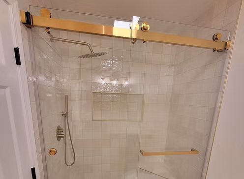 Shower glass panel installed over a bathtub